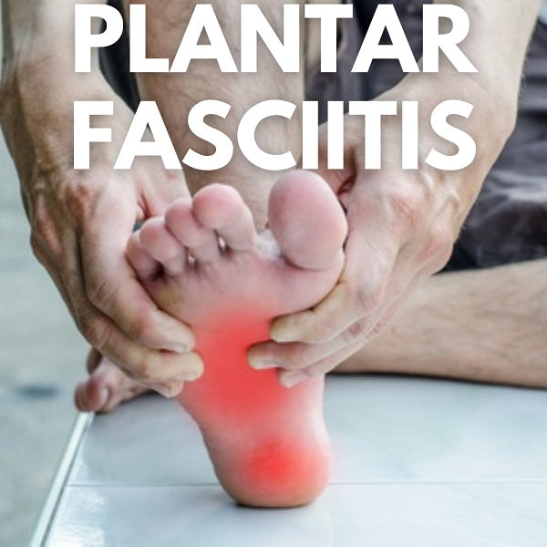 Image of a person grabbing his foot in pain from plantar fasciitis.
