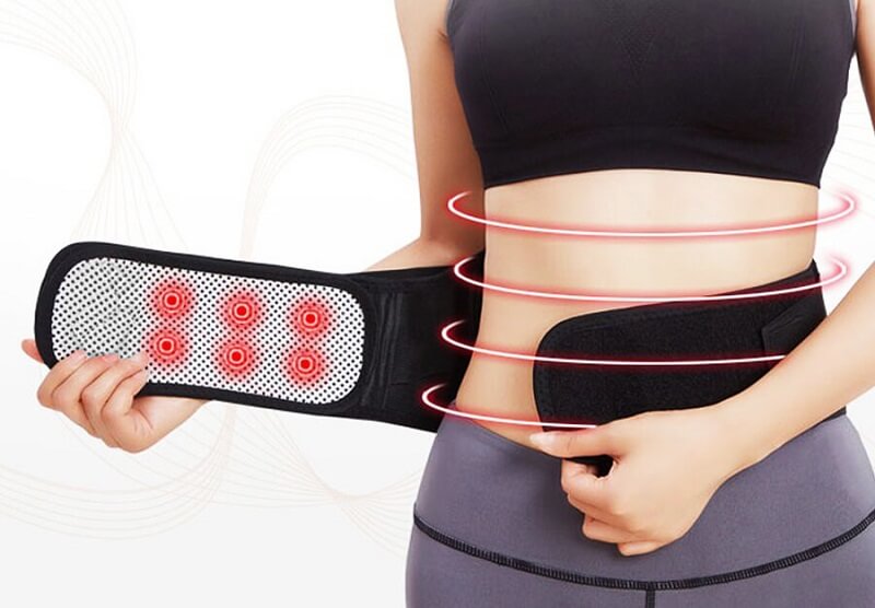 Image of a woman wearing the Thermotherapy Belt, a tourmaline self heating back brace.