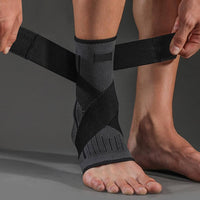 Thumbnail for Image of OrthoRelieve's ankle compression sleeve with support straps in black color.