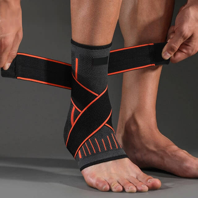 Image of OrthoRelieve's ankle compression sleeve with support straps in orange color.