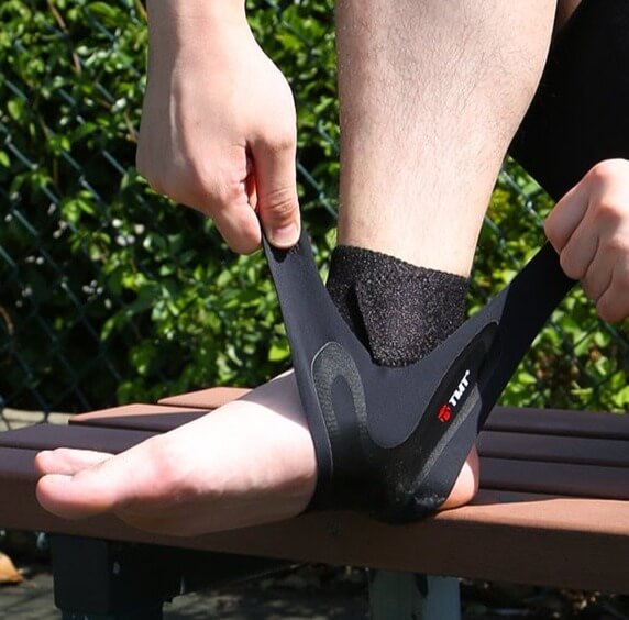 Image of Ultra Thin Ankle Compression Sleeve being worn in the outdoors.