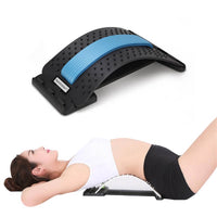 Thumbnail for Image of a woman lying down on the SpineCracker lumbar traction device.