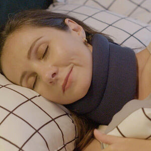 Image of woman sleeping while wearing the ComfyNeck neck brace.
